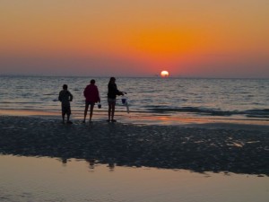 Three shellers at sunrise on Sanibel