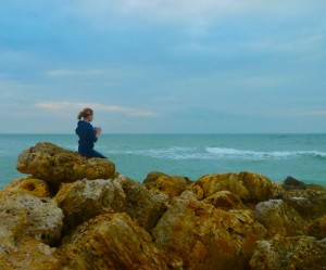 Young photographer on jetty Young photographer on jetty