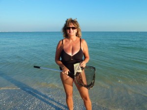 Collecting miniature seashells Collecting miniature seashells