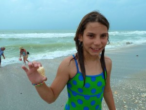 girl with cone seashell