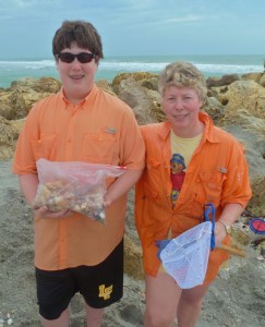 mom and son with seashells