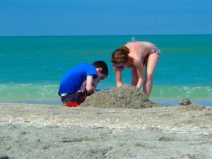 boy and girl sand pale boy and girl sand pale