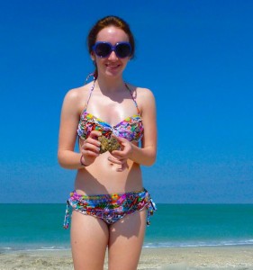 girl with heart on beach girl with heart on beach