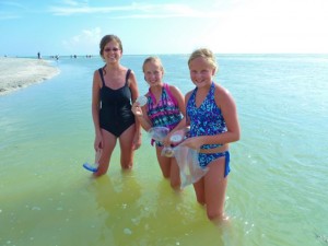 Kim, Hannah and Abby with sand dollars