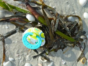 pacifier on beach pacifier on beach