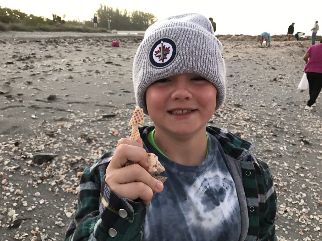 boy with junonia shell 